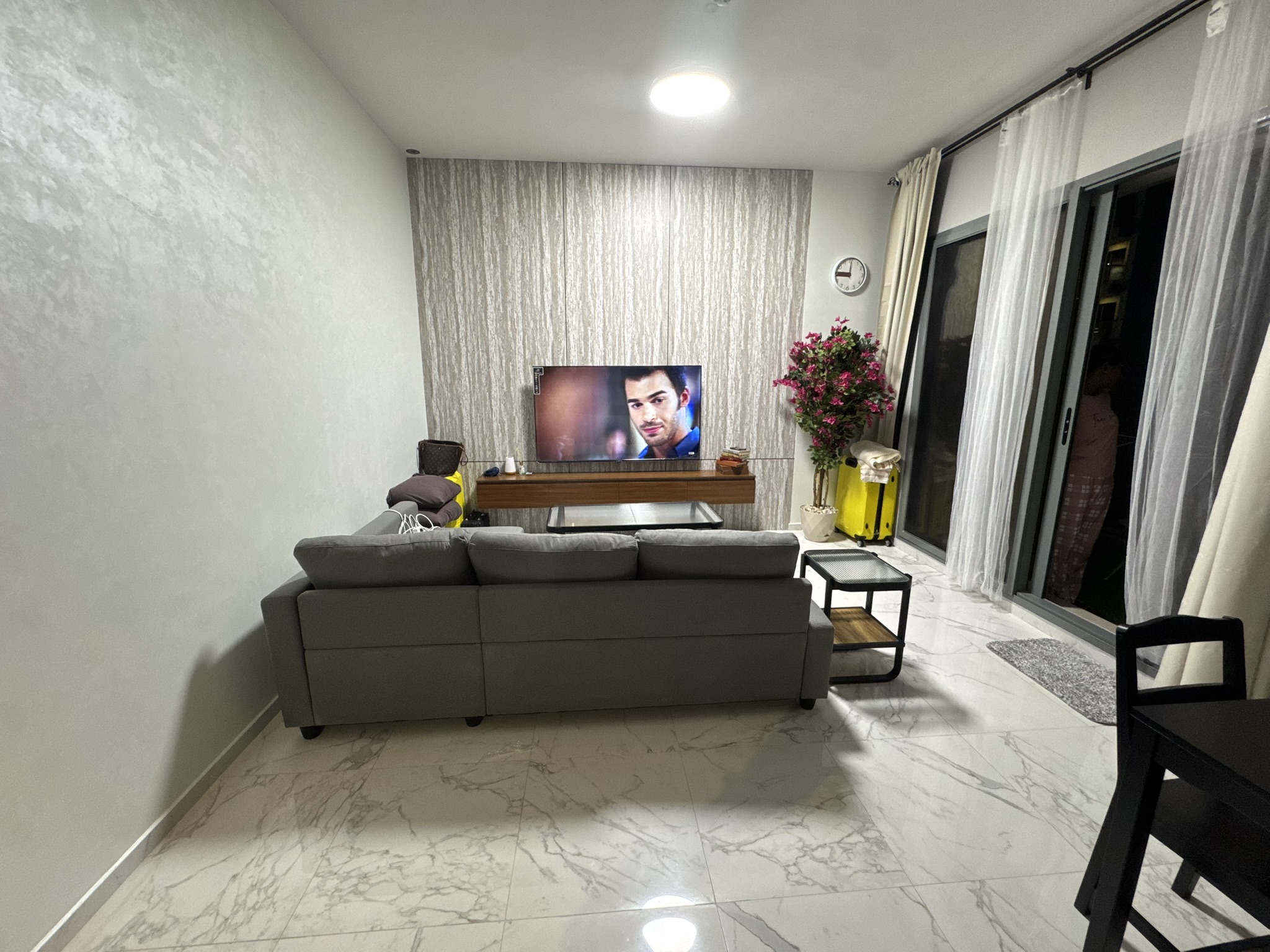 Living room and balcony doors at Golden Dream Tower 1 · Apartment 408